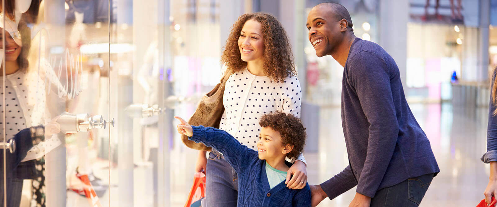 A military family window shopping together.